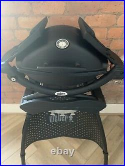 Weber Q1200 BBQ including stand and Weber cover